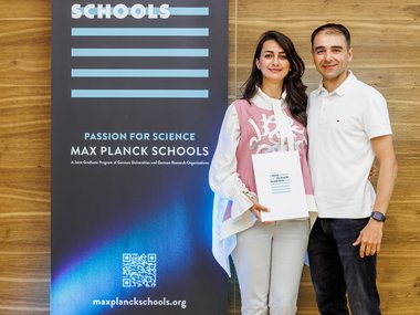 Max Planck Schools banner and two people.