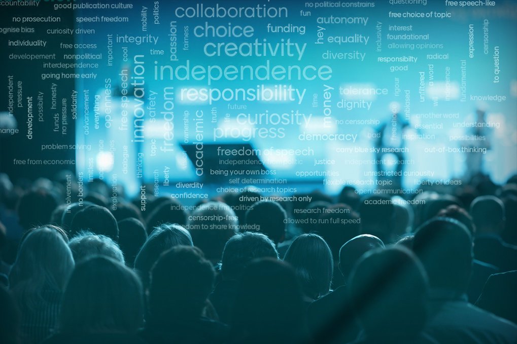 An audience observes a presentation with overlaid words related to creativity, independence, and responsibility, suggesting themes of innovation and freedom