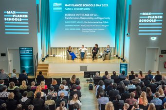 Sophie Stigler hosted the panel discussion with the three experts. As science journalist, she researches and communicates current scientific topics for public broadcasting. Four people discuss the role of science in the AI era on stage at the Max Planck Schools, while an audience listens.